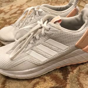 White and pink adidas tennis shoes